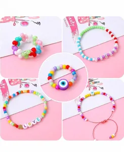 Detail view of handmade bracelets and rings featuring 4mm colorful glass rice beads.
