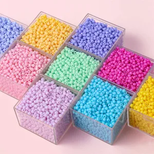 Vibrant 4mm colorful glass seed beads organized in clear boxes for DIY jewelry making crafts
