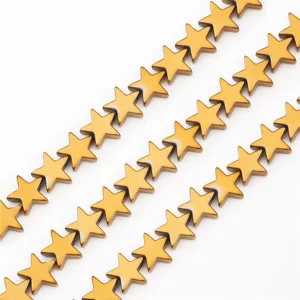Detailed close-up of shiny gold star-shaped hematite beads for DIY jewelry making.