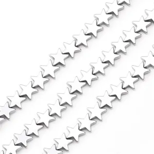Macro detail of silver metallic star-shaped electroplated beads for DIY jewelry making