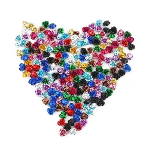 Close-up macro view of multi-colored mini aluminum rose beads for DIY jewelry making
