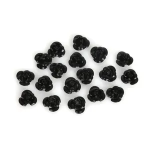 Macro detail view of black aluminum 3D rose flower charms for DIY jewelry making accessories.