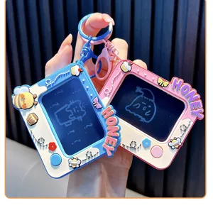 Close-up of cute cartoon bee doodle board keychains in pink and blue colors.