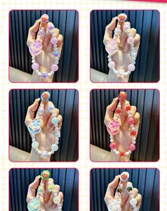 Six varieties of colorful luminous flower beaded phone straps held in hands