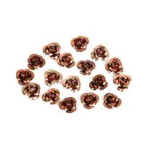 Macro detail view of metallic rose-shaped beads for DIY jewelry making and crafts