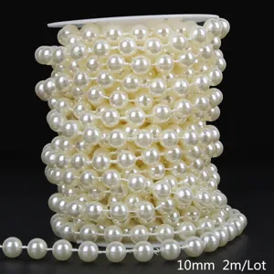 Close-up detail of 10mm cream ABS imitation pearl bead chain on spool for DIY wedding decor