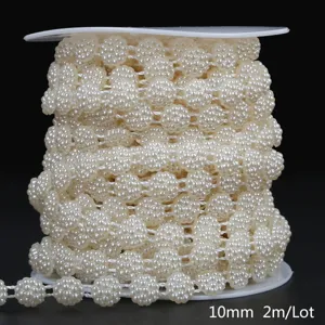Detailed view of 10mm off-white ABS faux pearl chain on a spool, total 2m length.