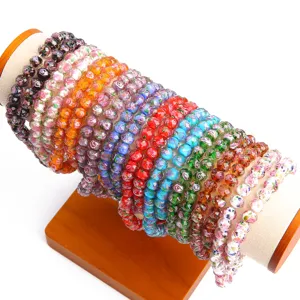 Vibrant colorful faceted sand glass wheel beads displayed for DIY jewelry making