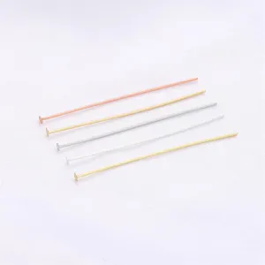 Detailed view of long flat head T-pins in various gold and silver metallic plating finishes