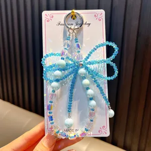 Elegante ciondolo per telefono in perline con fiocco di cristallo blu e perle per borse