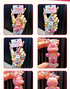 Detail view of colorful beaded unicorn keychains showing various styles and close-up textures.