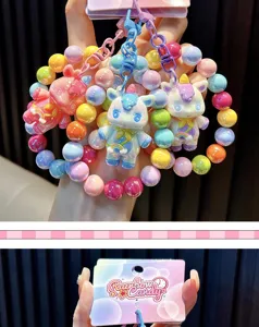 Close-up of Rainbow Candy branded packaging card for colorful beaded unicorn keychains