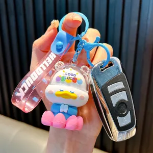 Cute cartoon duck character keychain with Good Luck message and pink wrist strap