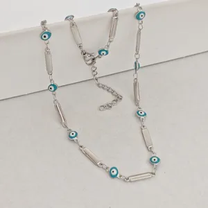Close-up of stainless steel Evil Eye necklace with blue enamel beads and bar links