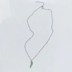 Silver stainless steel chain necklace featuring a vibrant green chili pepper pendant detail