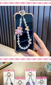 Close-up of sparkling heart bear beaded phone lanyard with display packaging