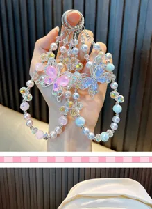 Detailed view of iridescent butterfly charms adorned with pearl and crystal beads