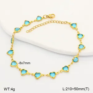 Detail view of gold stainless steel anklet with vibrant blue heart-shaped crystals