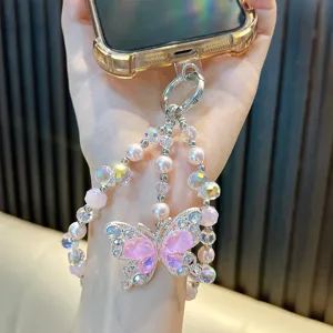 Elegant beaded phone charm strap featuring a pink butterfly crystal pendant and pearls