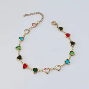 Detailed view of a gold stainless steel anklet with colorful heart-shaped charms.