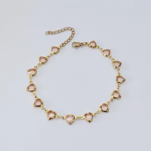 Detailed view of stainless steel anklet featuring delicate pink heart-shaped stones.