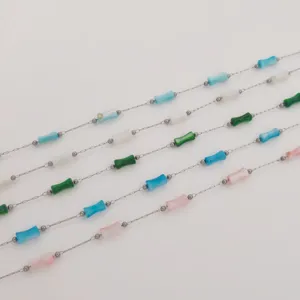 Detailed view of stainless steel bamboo chains featuring colorful acrylic beads.