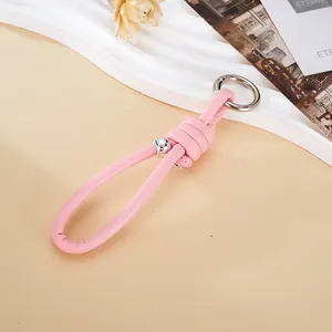 Minimalist pink leather phone wrist strap keychain with silver circular ring buckle