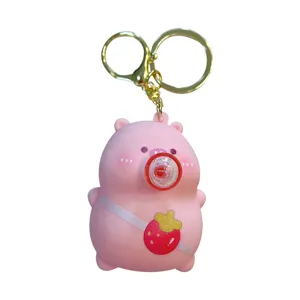 Simpatico portachiavi a compressione Capybara rosa con bolla e borsa fragola