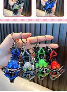 Detailed macro shot of motorcycle keychains in four colors with realistic flame design accents