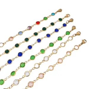 Set of gold stainless steel anklets with vibrant colorful round glass charms