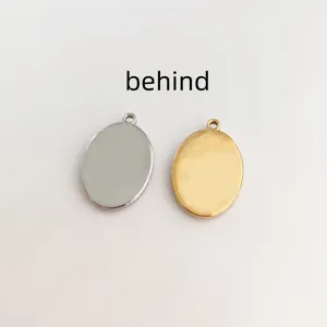 Detailed back view of gold and silver stainless steel oval pendants for jewelry