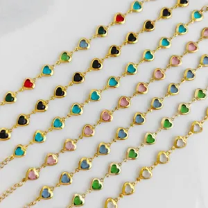 Detail view of colorful heart-shaped charms on gold-plated stainless steel chains