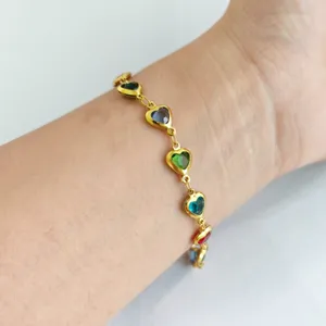 Elegant gold stainless steel bracelet featuring vibrant multi-color heart-shaped stones