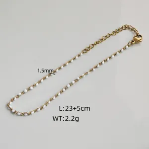 Close-up detail of stainless steel gold-tone anklet featuring 1.5mm white drip oil beads