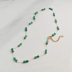 Detail view of stylish green bamboo bead necklace with gold stainless steel chain