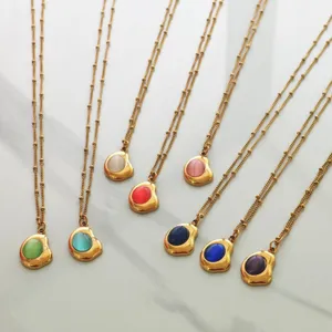 Exquisite stainless steel 18K gold necklaces with colorful oval gemstone pendants detail.