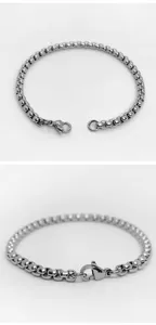 Macro detail of a unisex silver stainless steel rounded box link chain bracelet