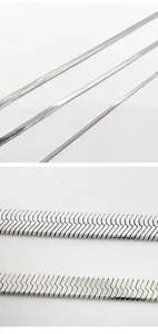 Close-up detail of stainless steel snake bone blade chain showing polished metal texture