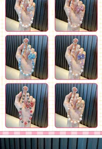 Elegant multi-color beaded phone wrist strap featuring a sparkling rhinestone bow charm