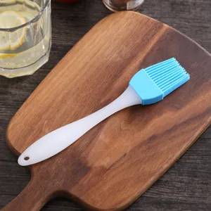 Close-up of a blue heat-resistant silicone basting brush for baking and BBQ use