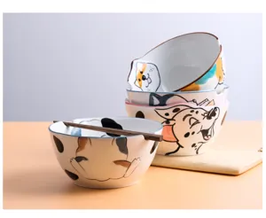 Close-up of Japanese ceramic ramen bowls featuring cute hand-painted cartoon animals