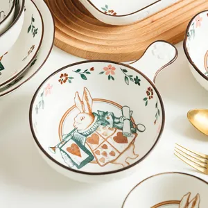 Japanese style ceramic bowl with rabbit pattern and handle for creative home dining.