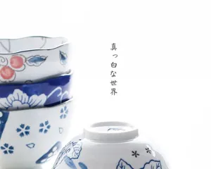 Macro view of Japanese style underglaze ceramic bowl with elegant blue floral patterns