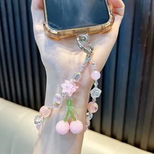 Beaded phone strap with pink cherry and flower charms for phone or bag accessory