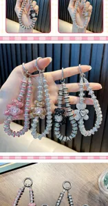 Detailed view of sparkly crystal-encrusted bear phone charms in multiple colors.