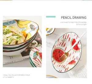 Detailed view of ceramic salad bowls with vibrant watermelon and banana fruit patterns