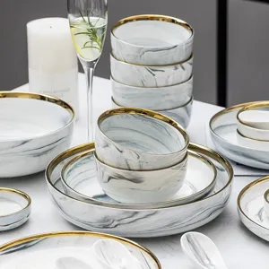 Luxuriöses Keramikgeschirr-Set mit Marmormuster und Goldrand, elegante Teller und Schalen