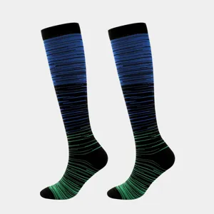 Detailed macro view showing the blue and green gradient striped texture of compression socks.