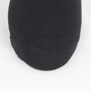 Macro view of the fine breathable knit texture of the black compression sock toe