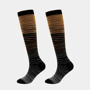 Detailed view of knee-high compression socks with orange and grey gradient stripes